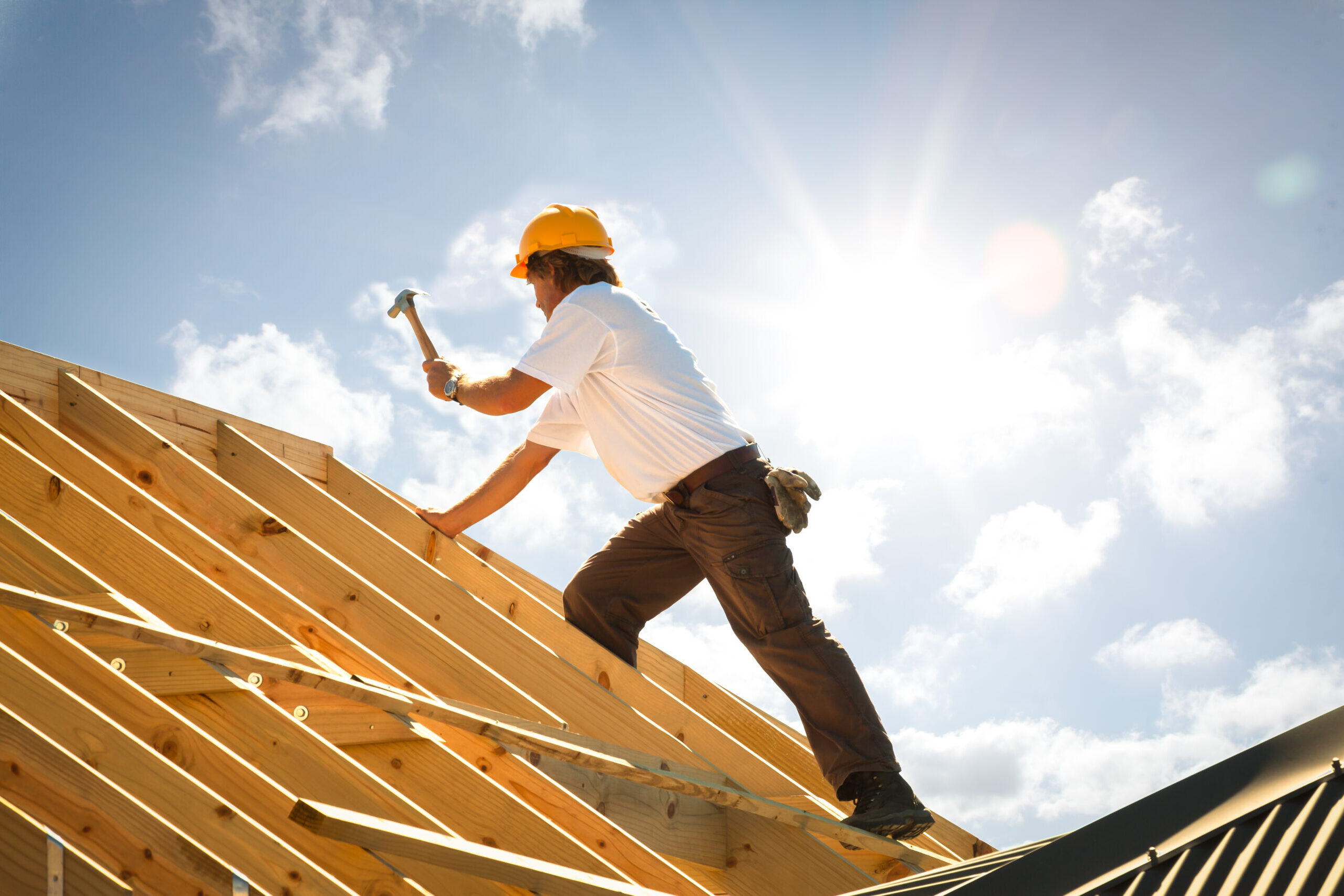 Roofer installing new roof tresses